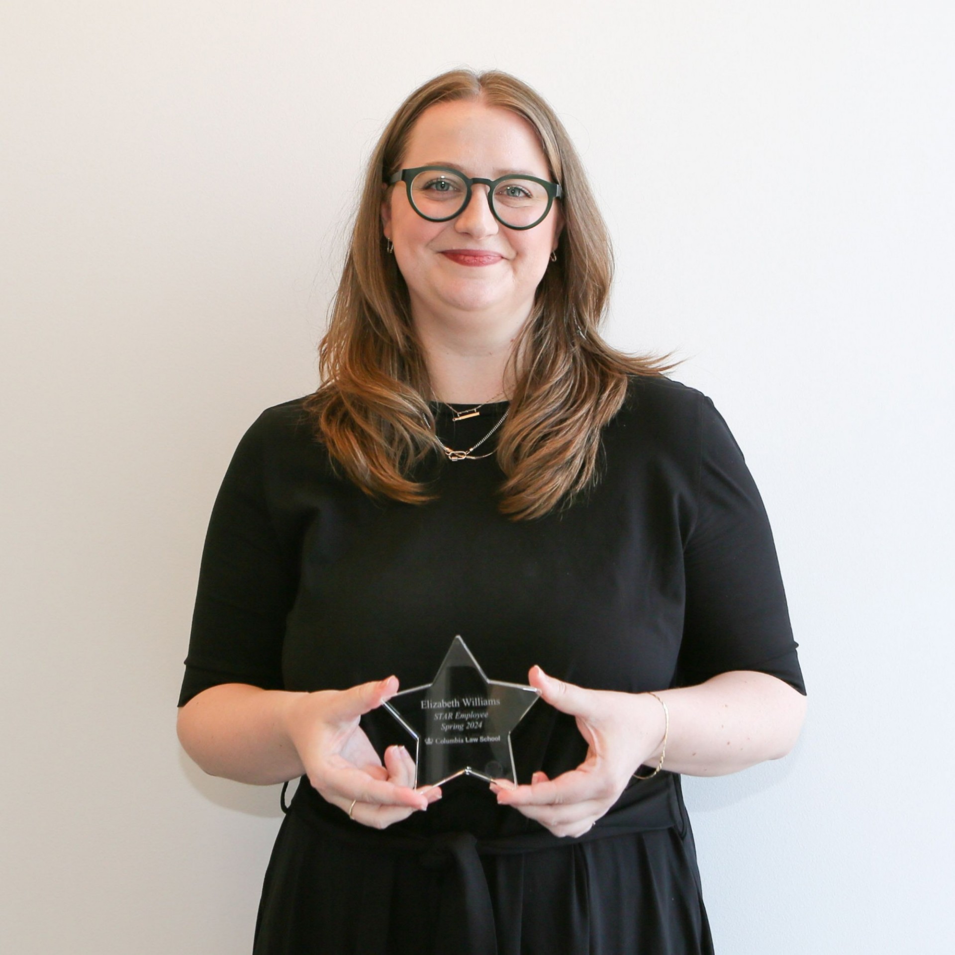 Pictured: Elizabeth Williams holding her STAR Award.