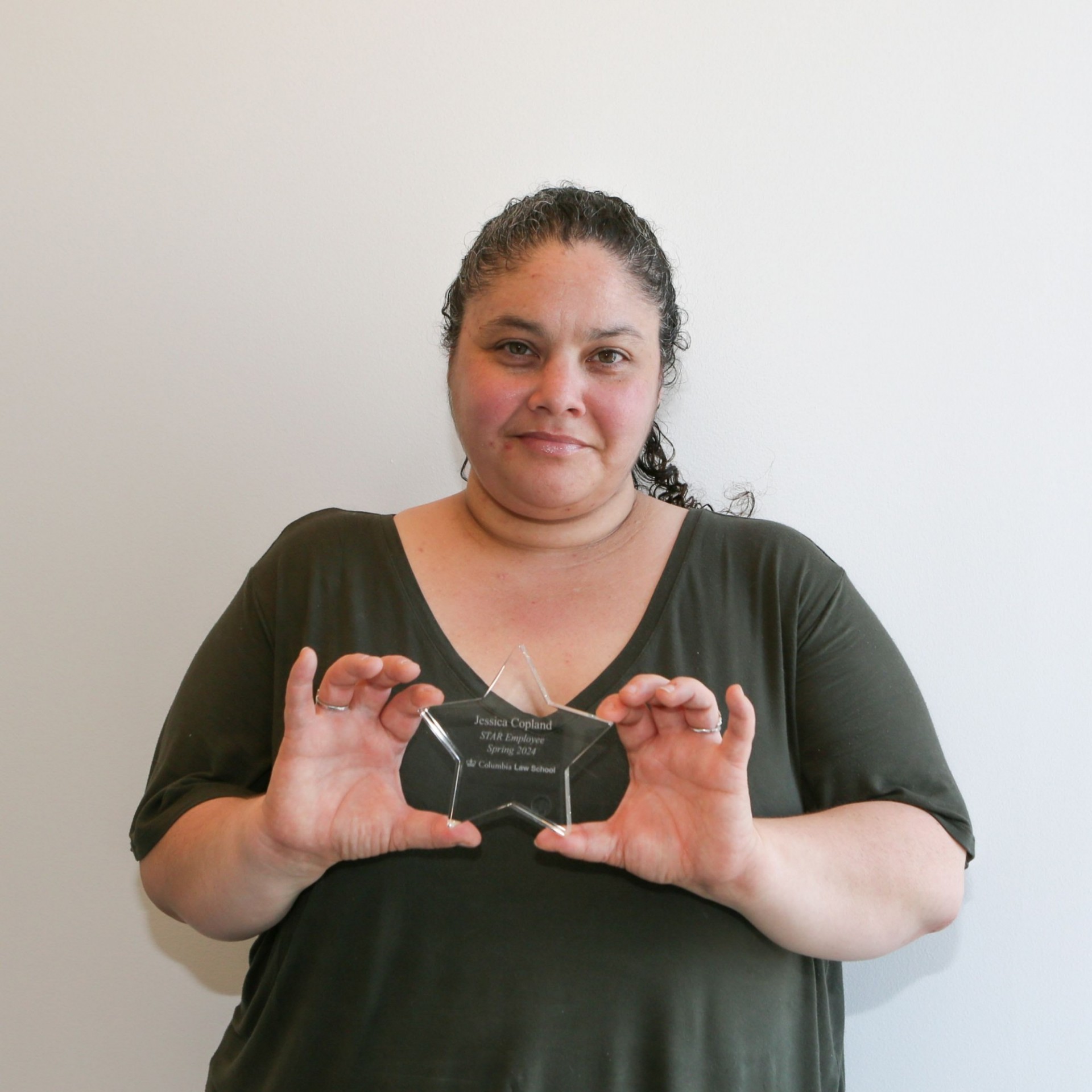 Pictured: Jessica Copland holding her STAR Award. 