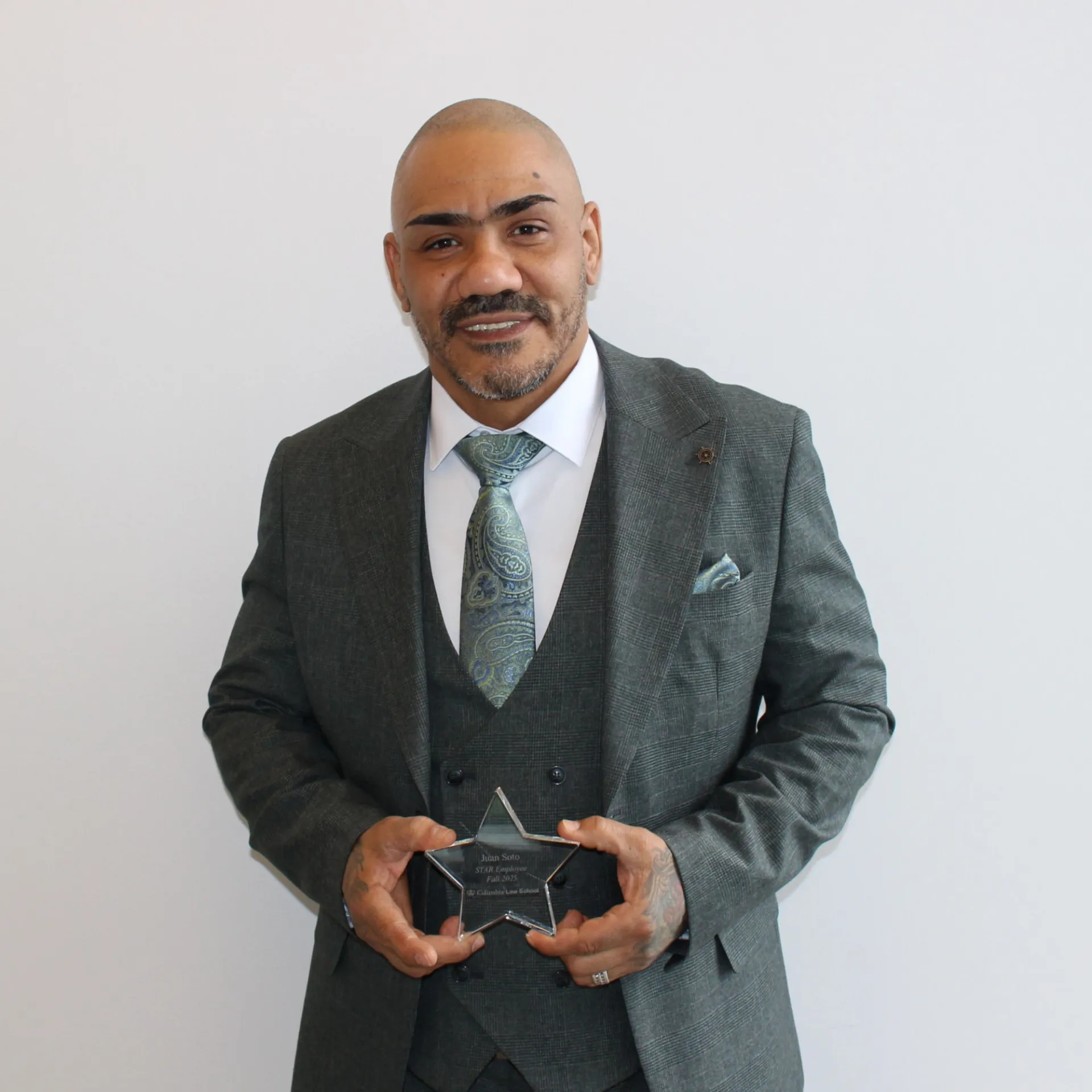 John Soto holding his STAR Award.