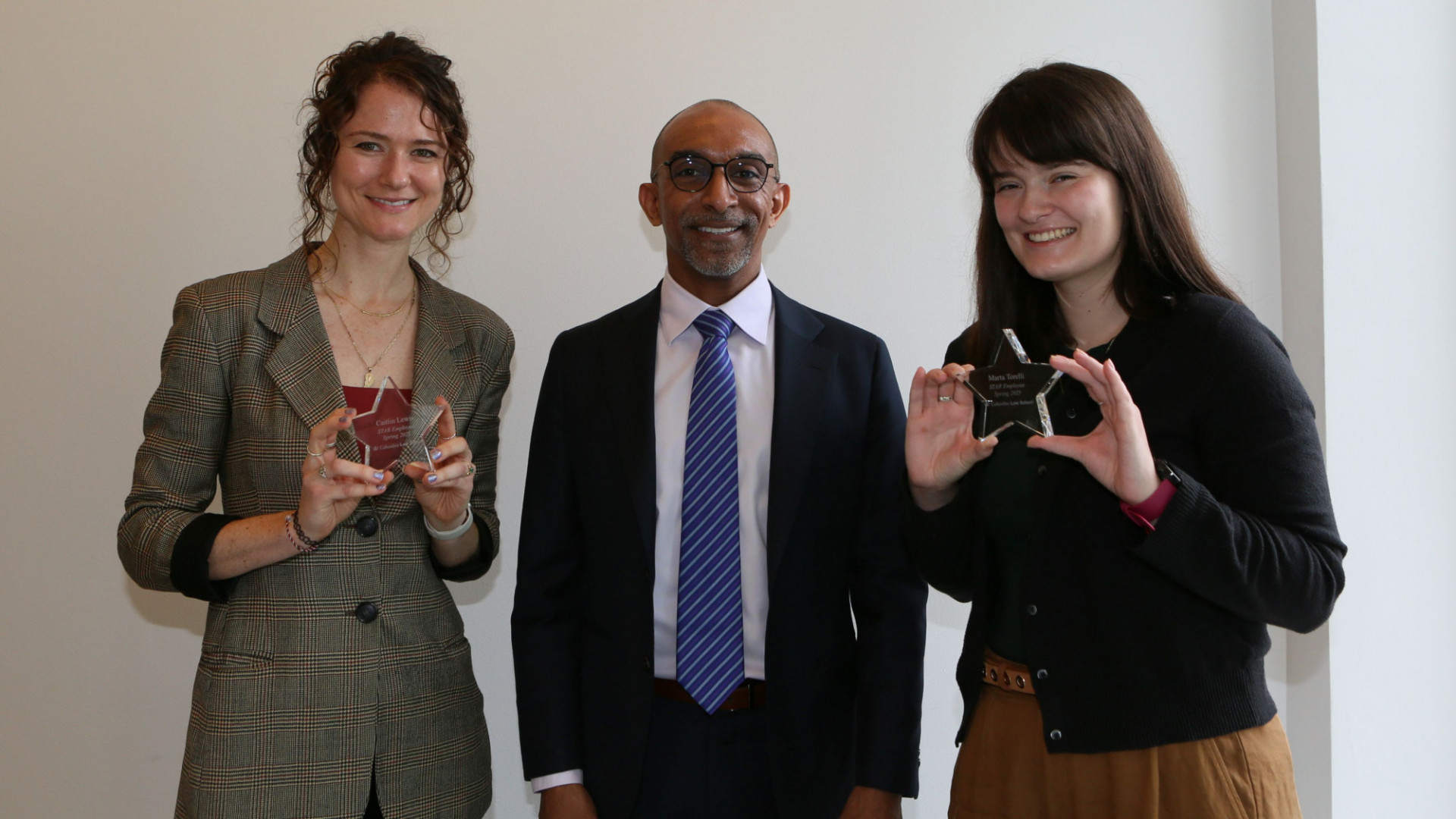Pictured above: Caitlin Lewis, Dean Daniel Abebe, and Marta Torelli. Not pictured above: Diana Pedi.